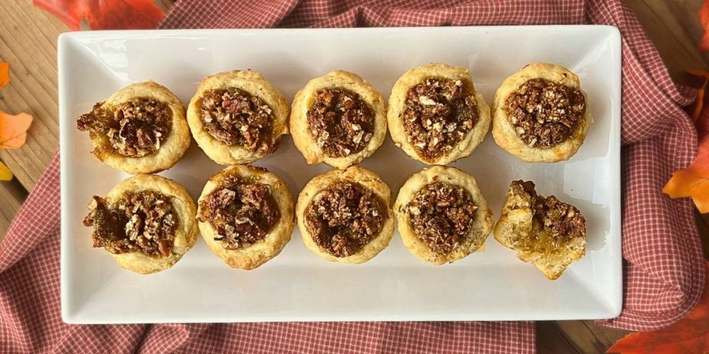 10 high altitude pecan tassies on a white platter