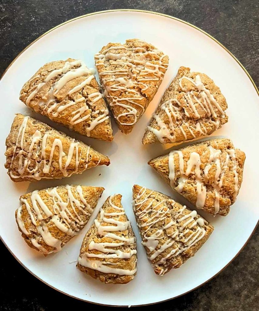 8 slices of cinnamon roll scones on a white platter